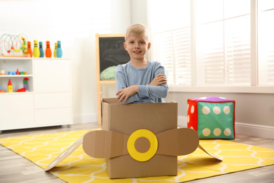 5. pix kid playing w box 2